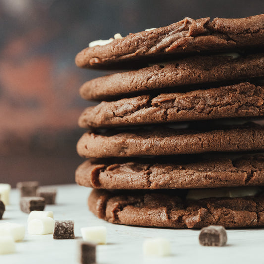 Triple Chocolate Chunk Cookies - Freshly baked cookies loaded with chunks of white, milk, and dark Belgian chocolate.